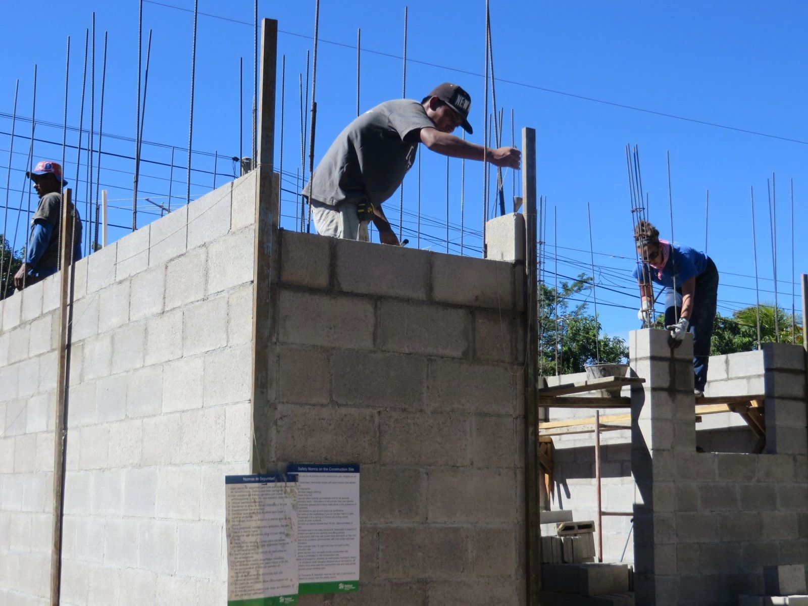 Construction workers building concrete structure